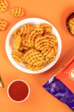 waffle fries with ketchup and packet full of waffle bites