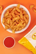Golden potato wedges packet with ketchup