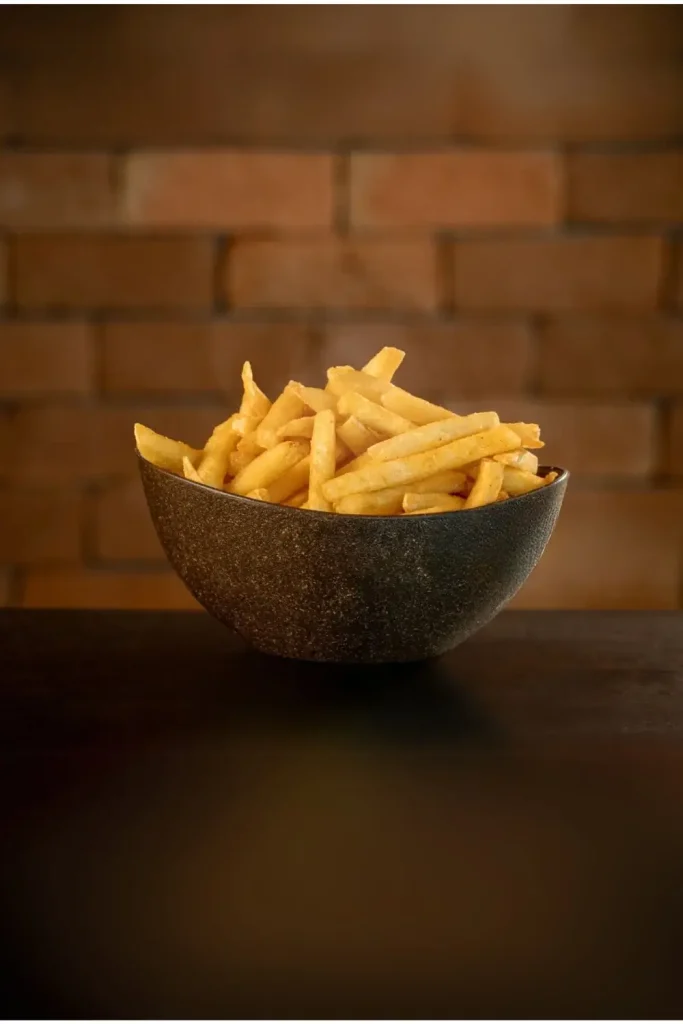 frozen straight cut fries in bowl ready to serve for customers